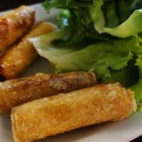 Chả Giò - Spring Rolls · Mini fried rolls filled with pork served with lettuce, mint & fish sauce.