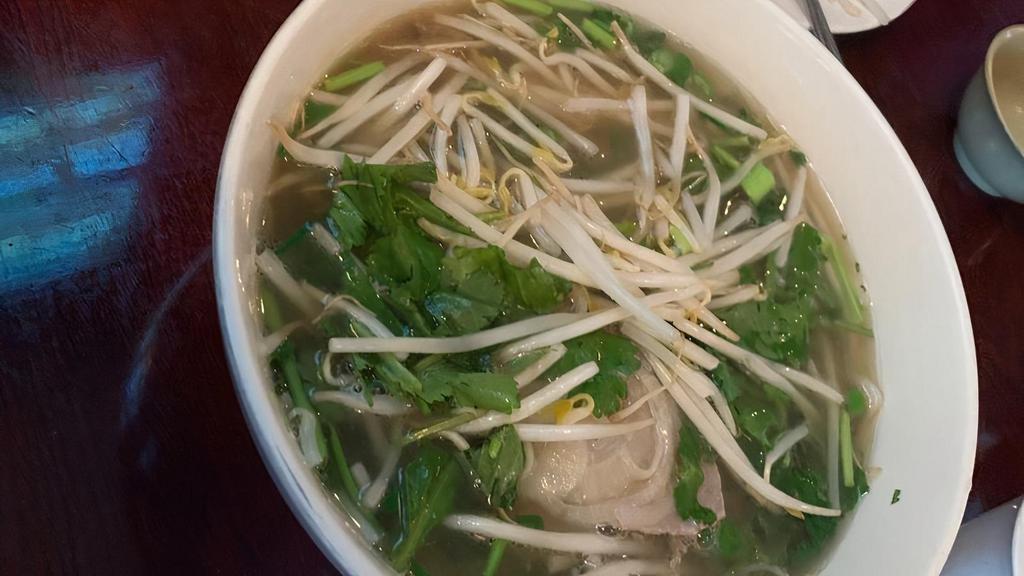 Pho Xe Lua - House Combo Phở (X Large) · Combination of rare beef, well done beef, brisket, tendon & tripe.