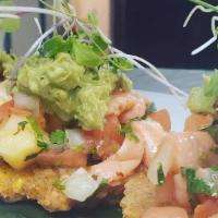 Tostones Alla Cancun  · Try our fresh shrimp cocktail served over tostones (fried plantain) & topped with