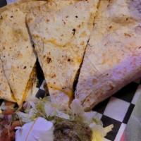 Killer Quesadilla · A forteen inch monster of a tortilla covered with melted colby jack and cheddar cheese. Serv...