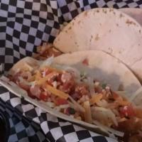 Tres Tacos · Your choice of fajita chicken, seasoned ground beef or pulled pork on a flour tortilla with ...