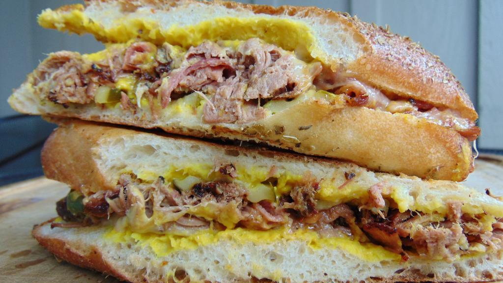 Cubano · Ham, roasted pork, swiss cheese, pickle, mustard, herb ciabatta roll.