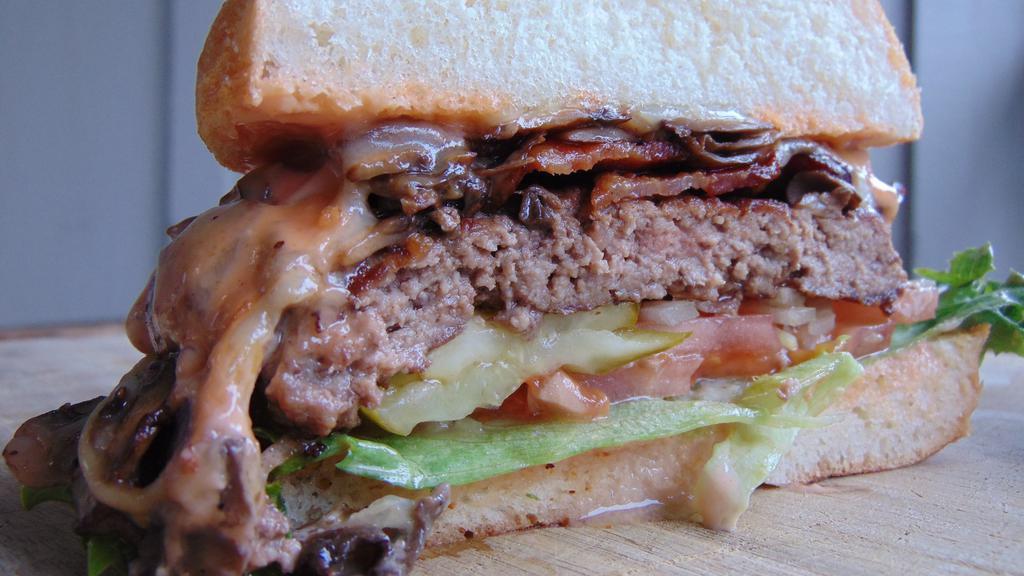 Mushroom, Smoked Swiss Burger · Ground chuck, bacon, lettuce, tomato, onion, pickle, house spread, pub bun.