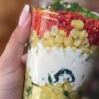 Esquite · Corn made with epazote then layered with our Mexican sour cream, queso fresco, Takis, and ja...
