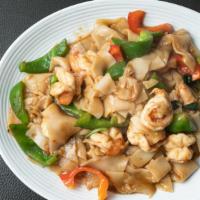 Drunken Noodle · Spicy. Flat rice noodles sautéed with brown basil sauce, garlic, red and green peppers, fres...