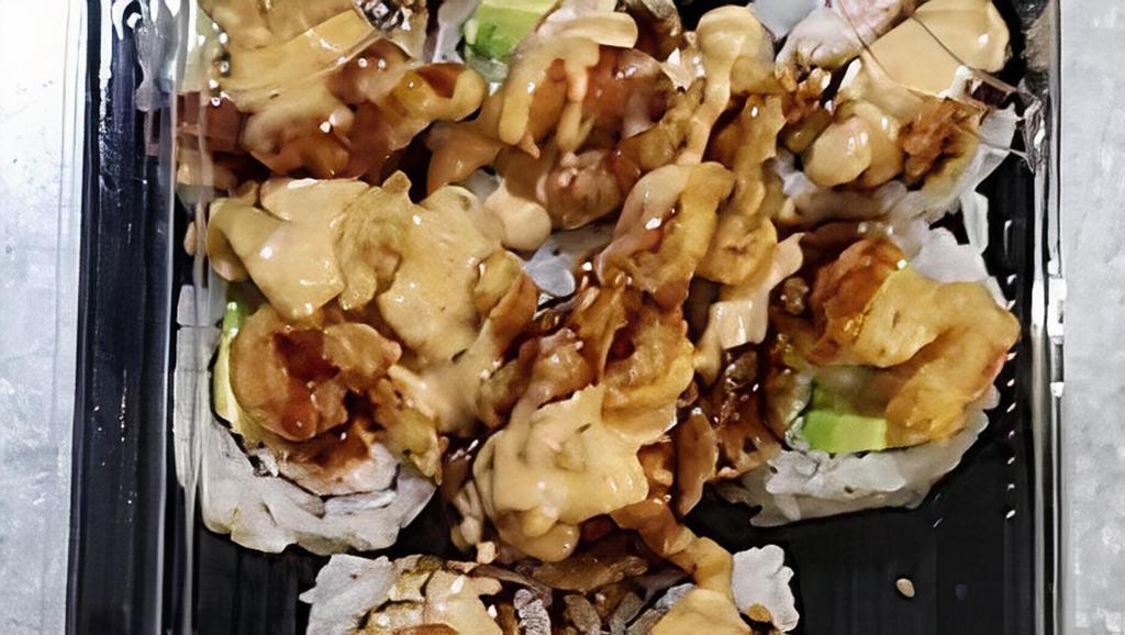 Cajun Roll (Spicy) · Soft Shell Crab Tempura, Crabmeat, Avocado, Eel Sauce, Sushi Rice, Wrapped with Seaweed Paper. Cooked