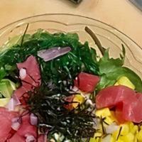 Tuna Salad · Tuna, mango, avocado, onion, sesame seed, seaweed salad, dry nori, and spring mix with Japan...