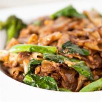 Pad Seew · Flat rice noodles stir fried in sweet black bean sauce with both American and Chinese brocco...