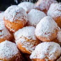 Zeppole (Fried Dough Boys) · Bite sized dough fried and rolled in powdered sugar, served with a side of Nutella sauce. We...