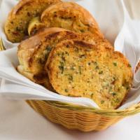 Garlic Bread (4 Slices)  · Italian bread topped with Sabatino's award
winning blend of butter, fresh garlic, grated
che...