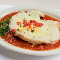 Chicken Parmigiana · A boneless breast of chicken lightly breaded, pan browned, topped with melted mozzarella che...