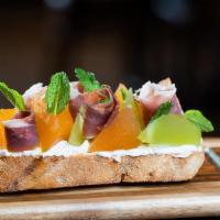 Prosciutto & Melon Toast · whipped goats cheese, sliced prosciutto, compressed melon, honey and mint served on toasted ...