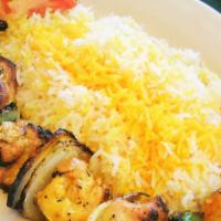 Chicken Kabob · Skewer of marinated chicken breast chunk fire grilled & served with fire roasted vegetables ...