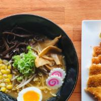 Tonkotsu Katsu Ramen · Pork katsu, egg, fish cake, scallion, corn, bamboo shoots, wood ear, nori, and black garlic ...