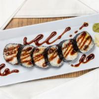 Spider Roll · Deep-fried soft shell crab, crab meat, cucumber, and avocado topped with eel sauce and seawe...