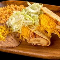 Two Chicken Tacos · Two hard shell chicken tacos with lettuce and cheese served with rice and beans.