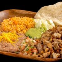 Carnitas Plate · Pork meat served with guacamole, pico de gallo, lettuce, rice, and beans.