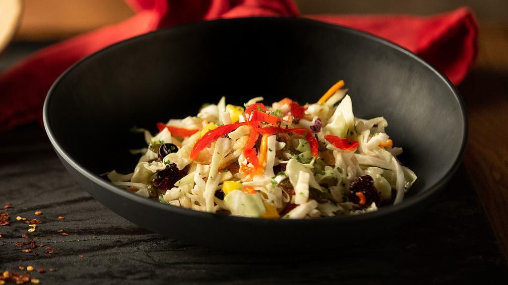 Peppadew Slaw · Red and green cabbage, spiced pumpkin seeds, cranberries, peppadew chillies, mangos and tropical dressing,