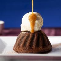 Sticky Toffee Pudding (V) · Warm spiced date cake drizzled with sticky toffee sauce served a la mode with vanilla bean i...