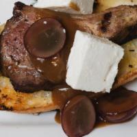 Greco Chops · 3 lamb chops, feta, candied walnuts, grapes, rosemary honey over crostinis.