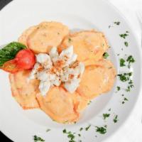 Blue Crab Ravioli · Blue crab, fresh herbs & cheese filled ravioli, rosy alfredo, jumbo crab meat.
