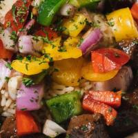 Pepper Steak · Tenderloin beef tips simmered in beef stock with bell peppers. Served over rice. Served with...