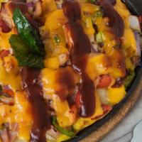 Country Skillet · Skillet potatoes topped w/ ham, peppers, onions, cheddar, scrambled eggs, BBQ sauce.