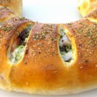 Family Stromboli · Pick you protein, chicken or gyro meat and types of vegetables with cheese in marinara sauce...