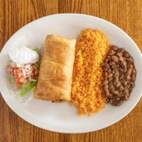 Chimichanga · Rolled flour tortilla filled with your choice of shredded chicken or beef and deep fried to ...