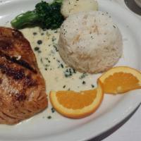 Salmon With Caper Sauce · Grilled salmon over a light creamy caper sauce with garlic and garnished with broccoli.