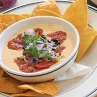 Cider Queso · cider queso and roasted tomato salsa with chips