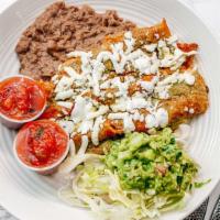 Enchiladas Plate · Two enchiladas of your choice topped, with cheese, green sauce, pico de gallo, lettuce, sour...