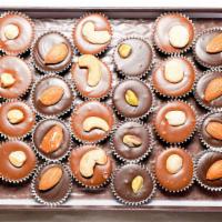 Nuts About Nuts Signature · 24 pieces. Our assortment of nuts in our gourmet milk and dark chocolate. Each box may inclu...