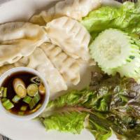 Gyoza · Mixture of pork and vegetables. Served with a seasoned soy dip.