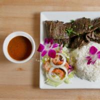 Churrasco  · skirt steak ,topped with chimicuri sauce and pico de Gallo