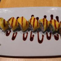 Mango Roll (8 Pc) · Shrimp tempura and crab layered with avocado and mango and drizzled with unagi sauce.
