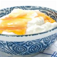 Greek Yogurt · Greek yogurt prepared with walnuts and honey.