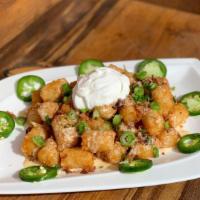 Crafthouse Tots · tater tots • beer cheese • jalapeños • bacon • parsley • sour cream