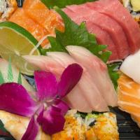 Sushi & Sashimi Combo · 3 pcs tuna, 3 pcs yellow tail, 3 pcs salmon sashimi, 5 pcs sushi and 6 pcs california roll.