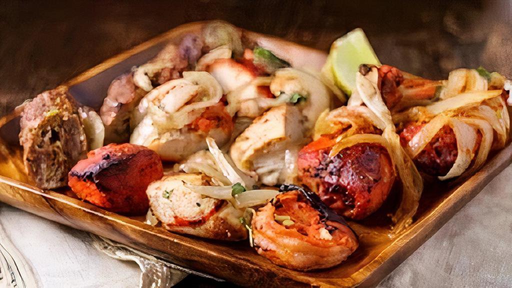 Assorted Kabob Platter · Assortment of chicken tikka, tandoori chicken and seekh kabab. (Serves Two).