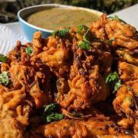 Veg Pakora (6 Pieces) · Spicy fritter made of potatoes and onions, coated in spiced gram flour and deep-fried until ...