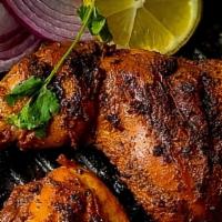 Tandoori Chicken (4 Pieces) · Chicken with bone, marinated in yogurt, ginger and freshly ground spices, skewered and grill...