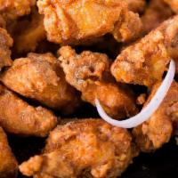 Chicken Pakora · Chicken pieces marinated and dipped in spices, battered and fried until golden brown.