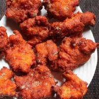 Fish Pakora · Fish marinated and dipped in spices, battered and fried until golden brown.