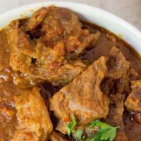 Lamb Vindaloo · Lamb cubes cooked with fresh ginger garlic and potato in a tomato and onion gravy.