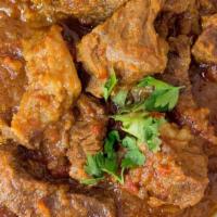Goat Curry · Lamb cubes cooked in a blend of Indian spices.