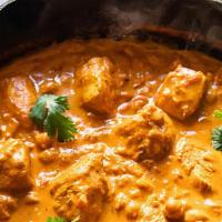 Goat Tikka Masala · Goat meat cooked in tandoor and simmered in tomato, onion cream with cashew nut gravy.