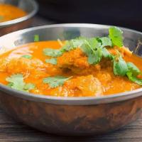 Chicken Vindaloo · Chicken breast cubes cooked with fresh ginger, garlic and potato in a tangy sauce.