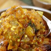 Baingan Bharta (Vegan) · Tandoori roasted eggplant cooked with onions, tomato and spices