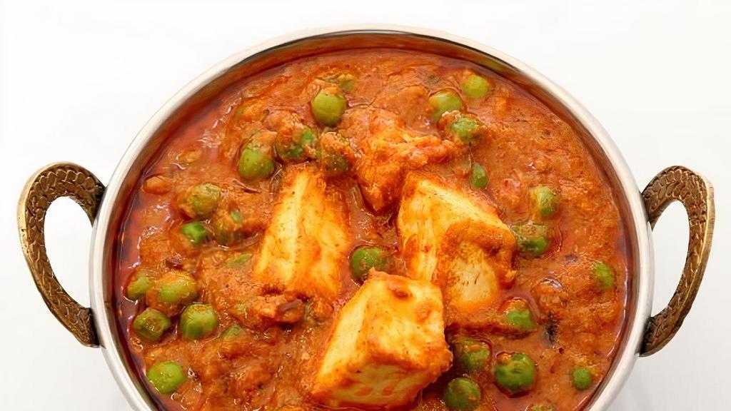 Mutter Paneer · Green peas and cottage cheese cubes cooked in a creamy sauce.